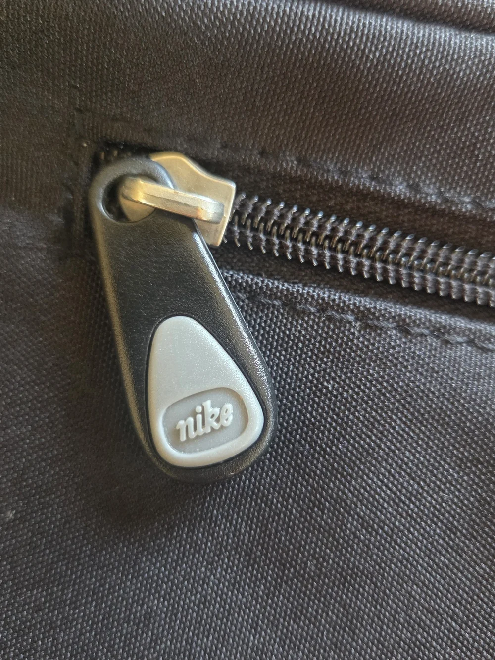 Nike Black Drawstring-Top Backpack with Front Zip Pocket